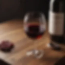 A glass of red wine placed on a wooden table, symbolizing the connection between alcohol and health.